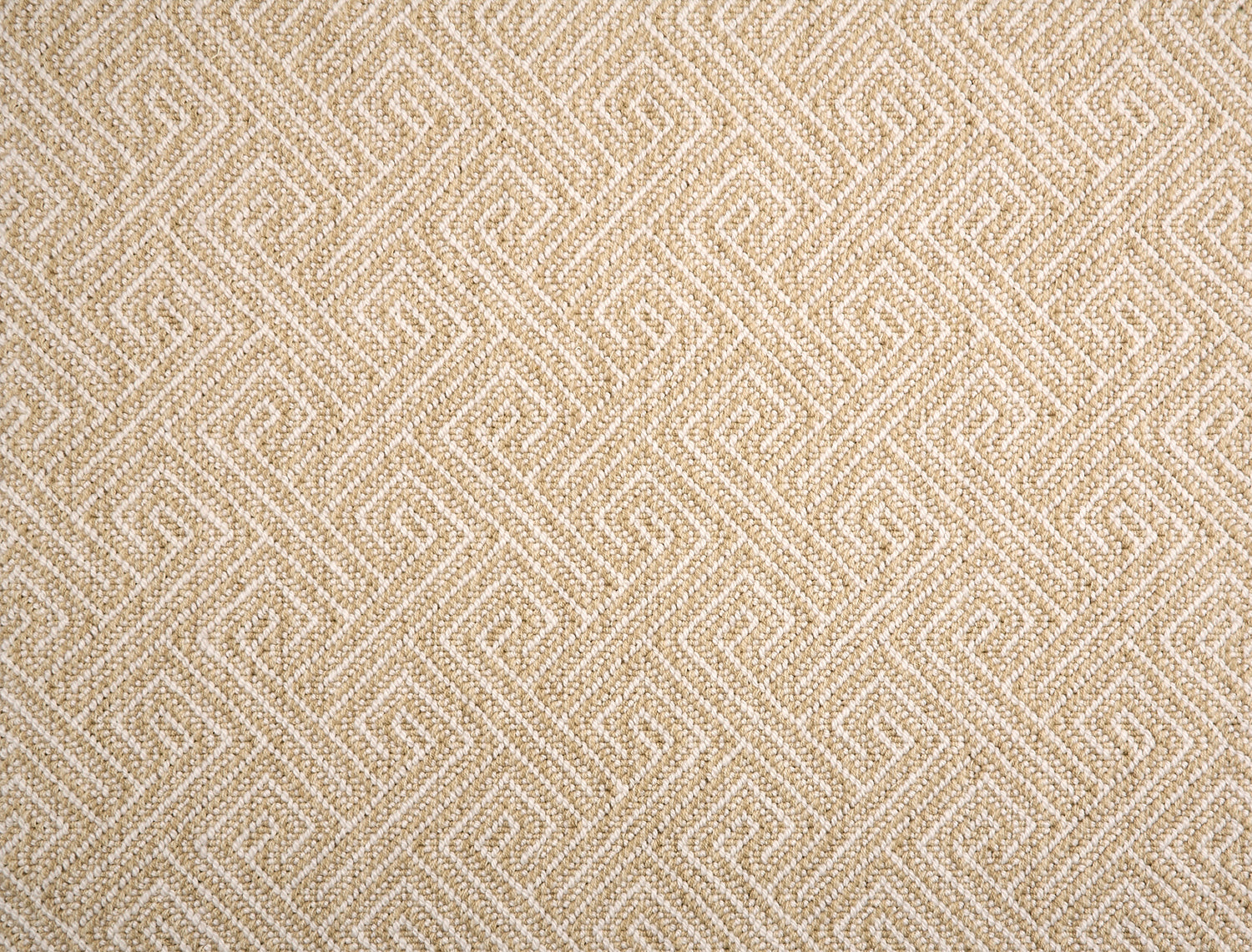 Broadloom carpet with Greek key pattern in cream on tan. 