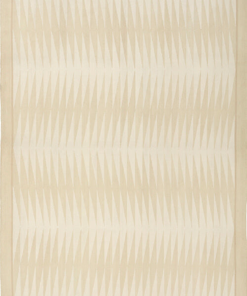 Handwoven rug in a geometric design in shades of beige. 