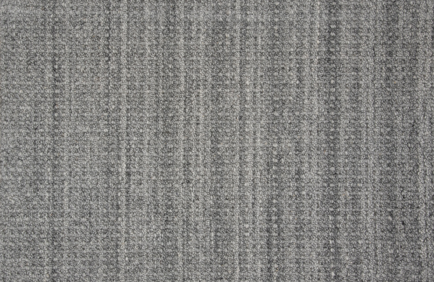 Textural broadloom carpet in heather grey.