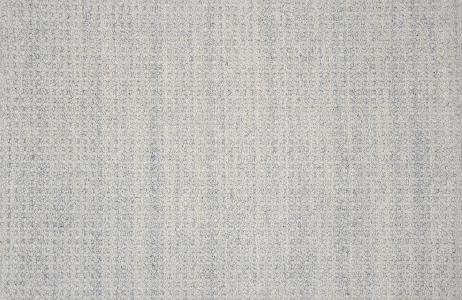 Textural broadloom carpet in light blue.