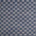 Close up of woven fabric with small scale checkerboard pattern in white and navy blue. 