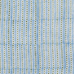 Detail of fabric in a geometric striped print in green and blue on a white field.