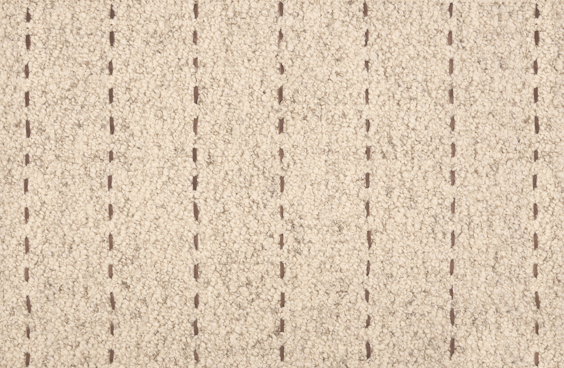 Broadloom carpet with a thin dashed stripe in taupe leather on a cream field