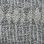 Handwoven rug detail in a diamond  design in grey 