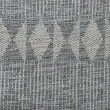 Handwoven rug detail in a diamond  design in grey 