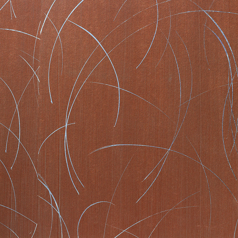 Detail of a wallpaper in an elongated paint splatter pattern in metallic silver on a rust field.