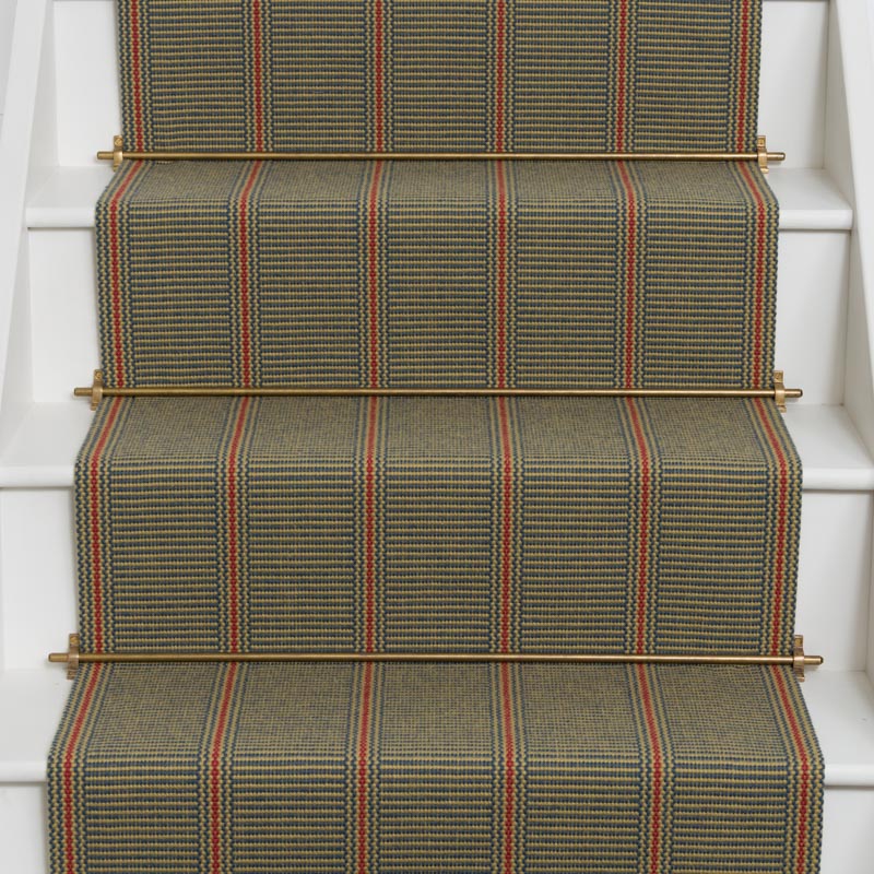 Striped flatweave runner in green and red on white staircase