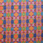 Close up of printed fabric with collaged pattern with striped and solid diamonds, squares and ovals in orange, red, pink, blue and green. 