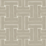 Detail of wallpaper in a large-scale interlocking geometric print in tan on a cream field.