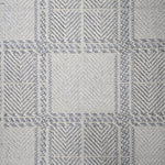 Broadloom carpet in wide box checkerboard pattern in cream and light blue.