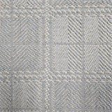 Broadloom carpet in wide box checkerboard pattern in light blue and cream. 