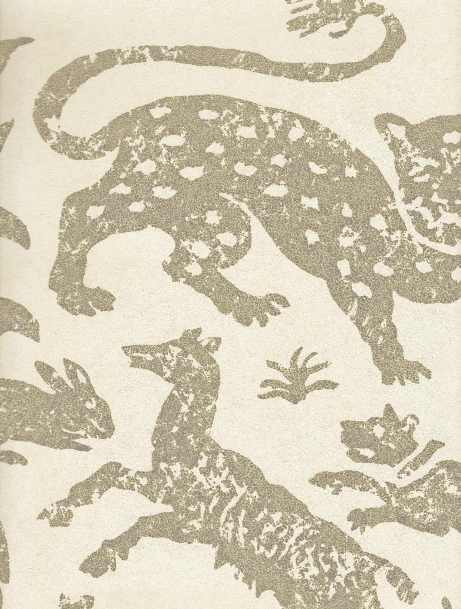 Detail of wallpaper in a playful animal print in tan on a cream field.