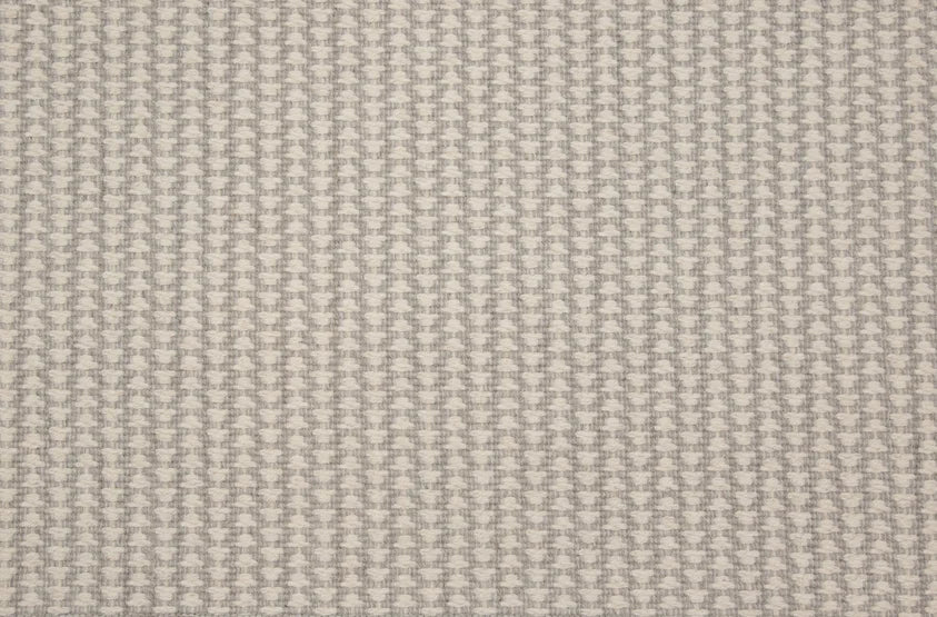 Broadloom carpet swatch in a textured pattern light grey color