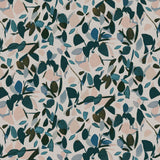 Detail of fabric in a minimal leaf print in shades of blue, brown and pink on a tan field.