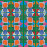 Close up of printed wallpaper with a complex geometric pattern with blue, orange, green, pink and red. 