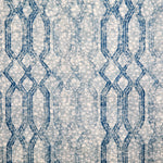 Printed fabric with monochomatic geometric stripe and mottled textural background in shades of blue. 