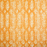 Printed fabric with monochomatic geometric stripe and mottled textural background in shades of orange. 