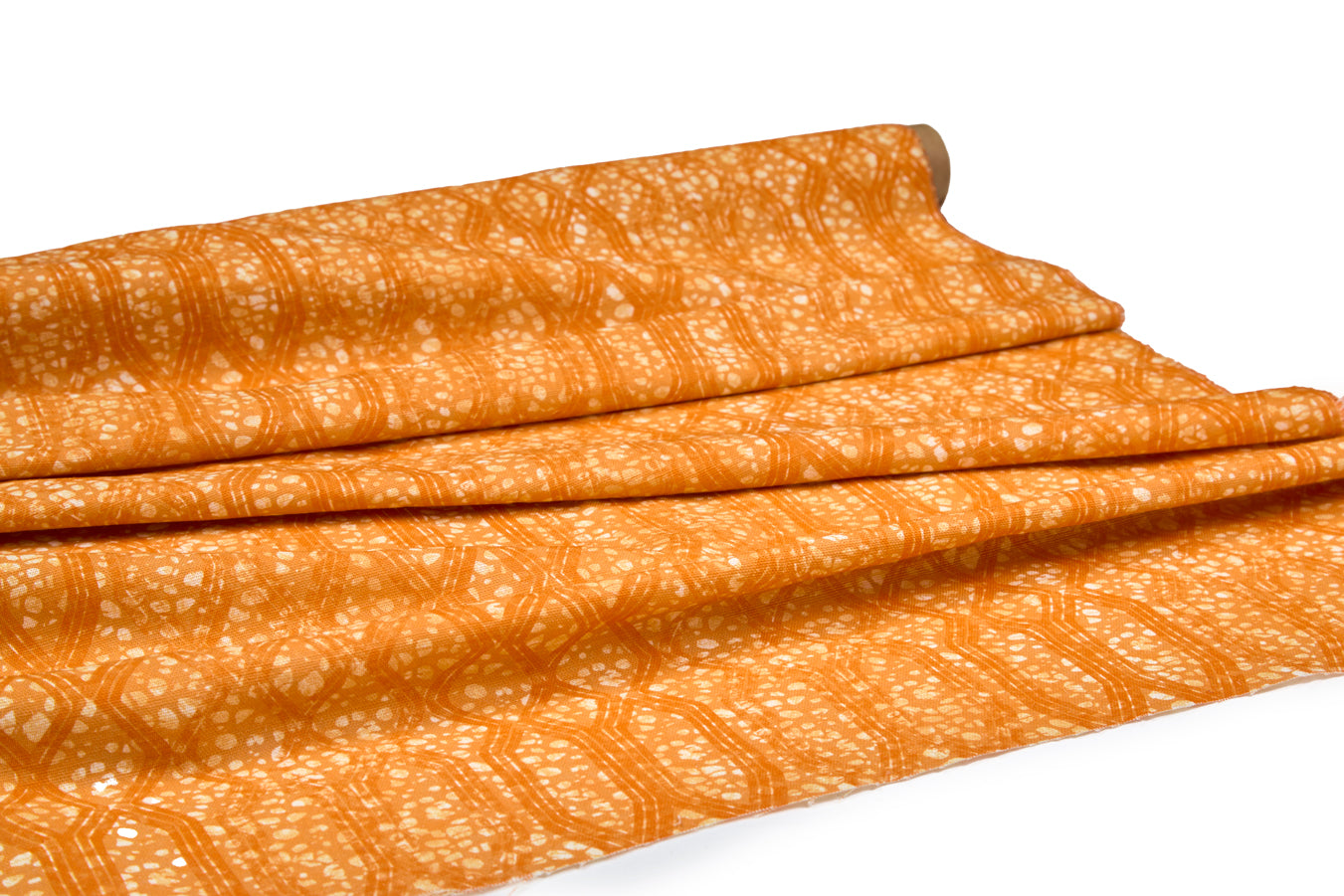 Draped fabric coming off a roll with monochomatic geometric stripe and mottled textural background in shades of  orange.