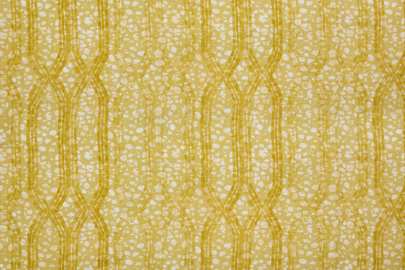 Printed fabric with monochomatic geometric stripe and mottled textural background in shades of yellow.