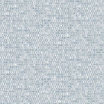 Detail of wallpaper in a textural geometric print in shades of blue on a white field.