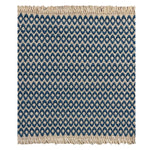 A woven rug sample with a marine blue and cream geometric oval pattern and fringed edges, shown flat against a white background.