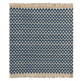 A woven rug sample with a marine blue and cream geometric oval pattern and fringed edges, shown flat against a white background.