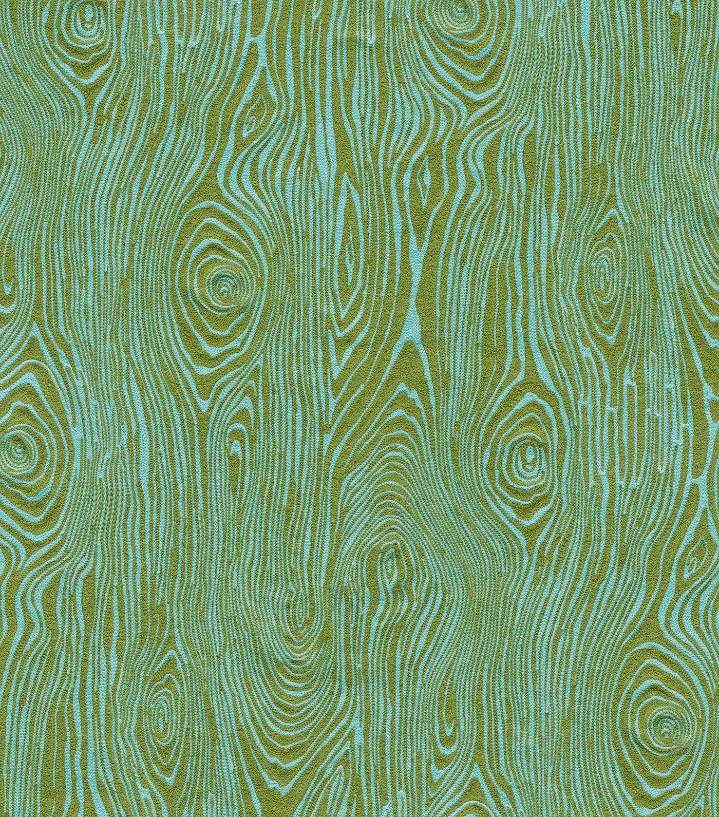 Detail of wallpaper in a textural wood grain print in green on a turquoise field.