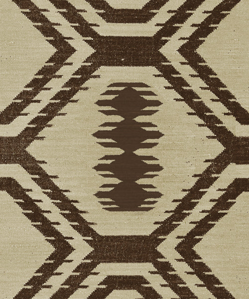 Handwoven rug with geometric pattern in brown and beige