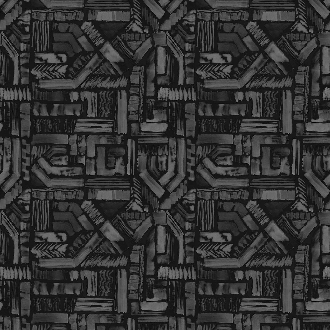 Detail of fabric in an absract geometric pattern in shades of charcoal and gray.
