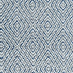 Handwoven rug in a geometric diamond pattern in blue, grey and white. 