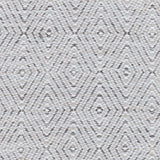 Handwoven rug in a geometric diamond pattern in white and grey. 
