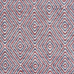 Handwoven rug in a geometric diamond pattern in red and purple. 