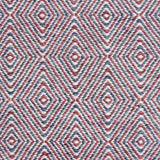 Handwoven rug in a geometric diamond pattern in red and purple. 