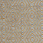 Handwoven rug in a geometric diamond pattern in grey, yellow and white. 