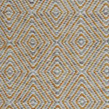 Handwoven rug in a geometric diamond pattern in grey, yellow and white. 
