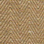 Handwoven rug in a herringbone pattern in grey and yellow