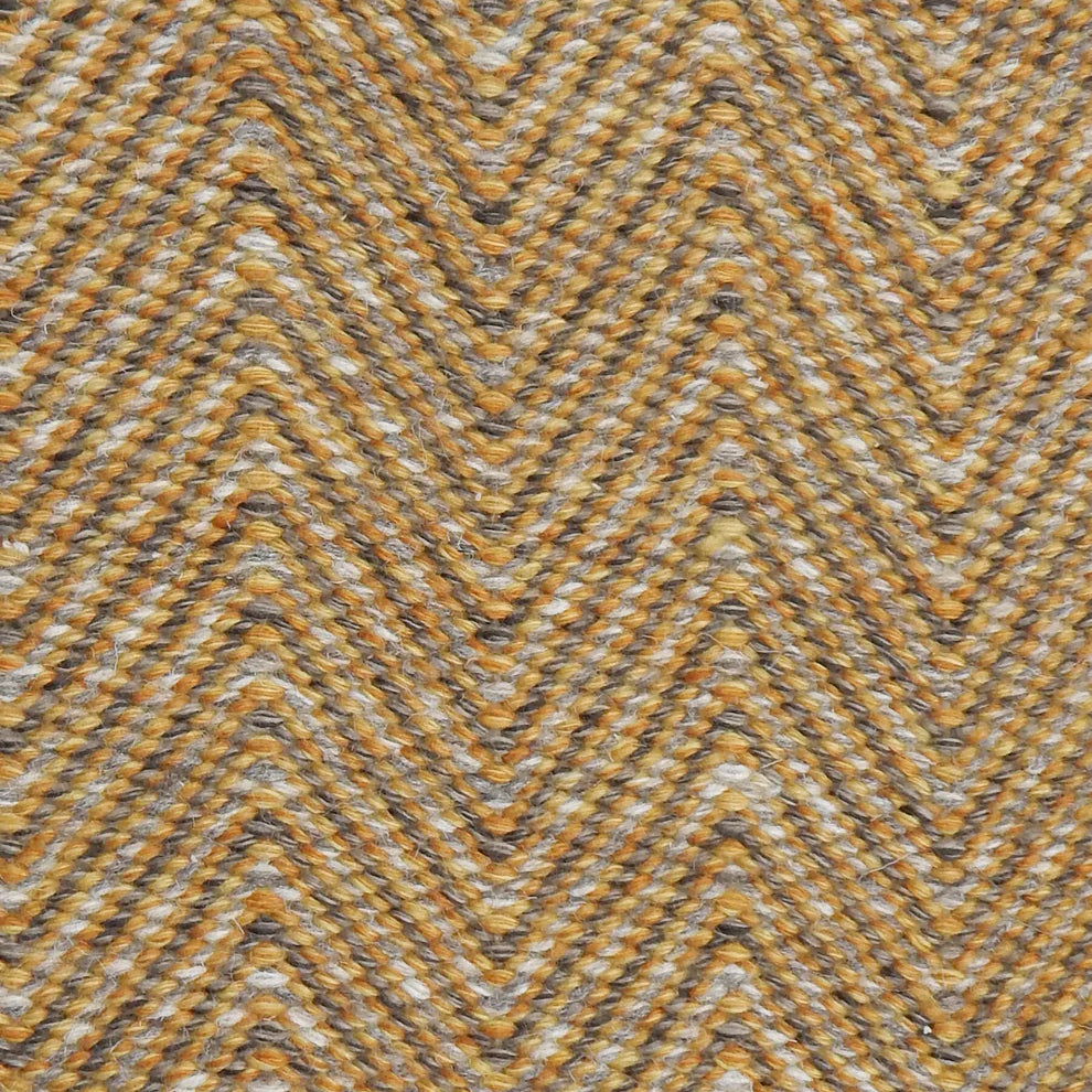 Handwoven rug in a herringbone pattern in grey and yellow