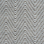 Handwoven rug in a herringbone pattern in shades of grey and white. 