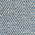Handwoven rug in a herringbone pattern in blue and grey. 