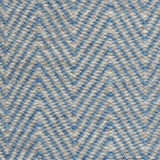Handwoven rug in a herringbone pattern in blue and grey. 