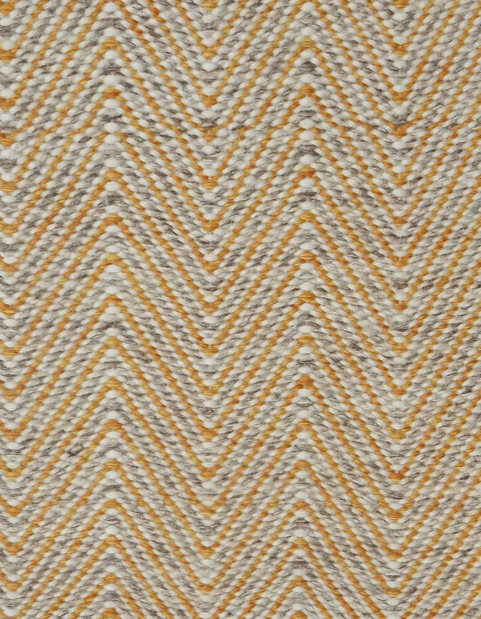Handwoven rug in a herringbone pattern in yellow and grey. 
