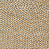 Handwoven rug in a herringbone pattern in yellow and grey. 