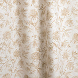 Draped fabric with watercolor floral pattern with tan leaves and flowers on a cream background