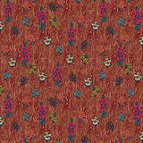 Scaled-out view of wallpaper in a varied floral print on a wood-grain field in shades of red, pink, yellow and green.