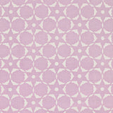 Fabric in a floral lattice print in cream on a light purple field.