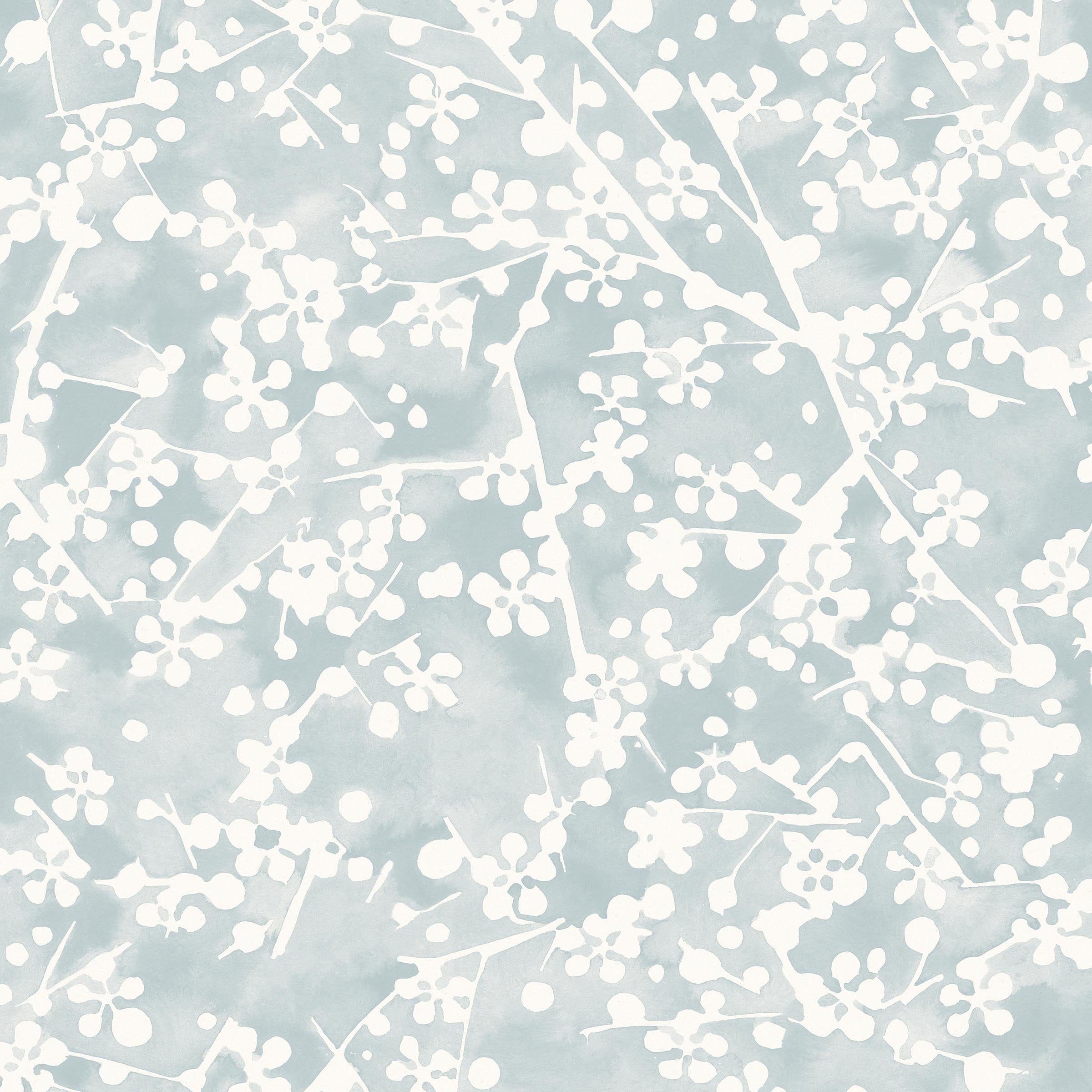 Detail of wallpaper in a painterly branch print in white on a light blue watercolor field.