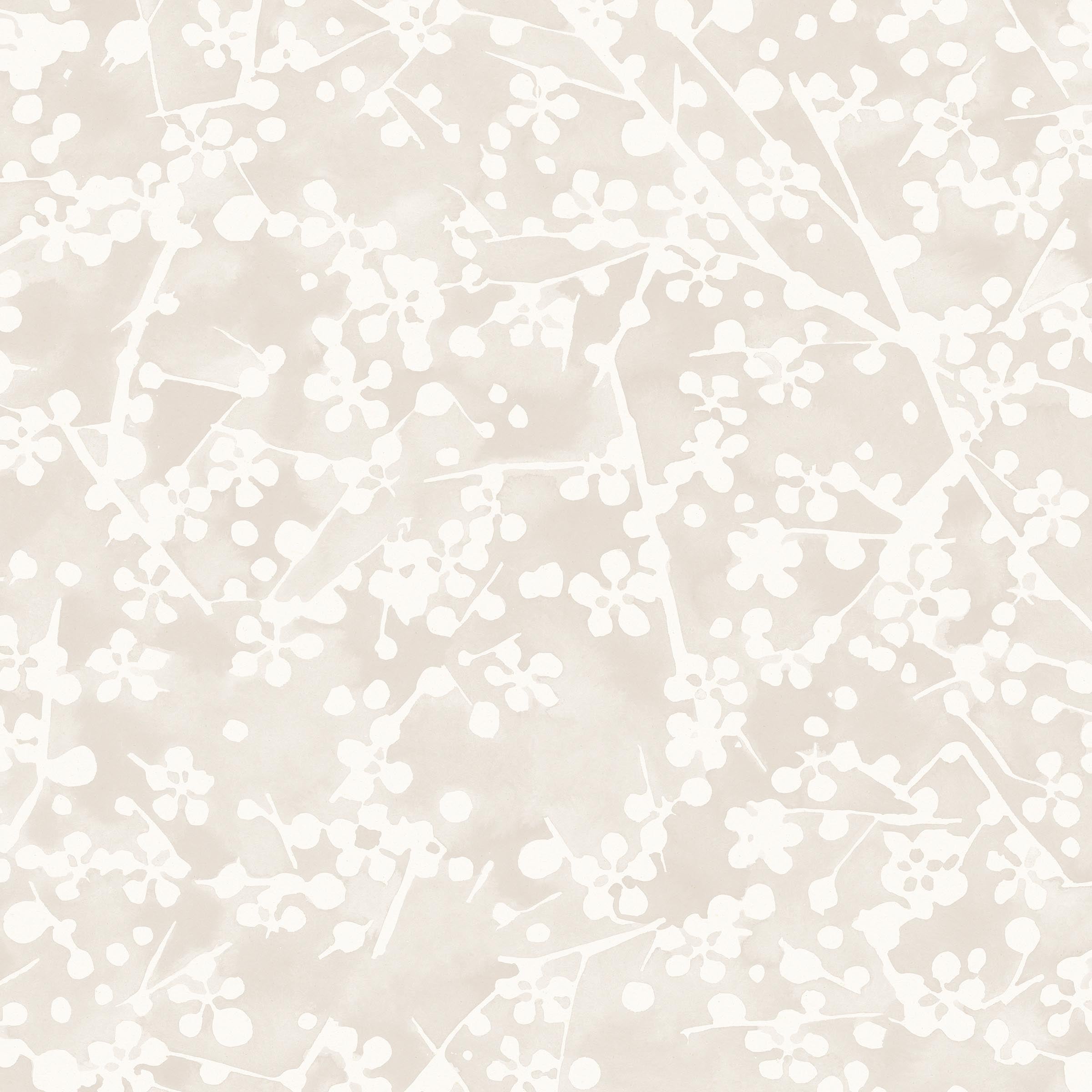 Detail of wallpaper in a painterly branch print in white on a soft beige watercolor field.