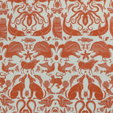 Patterned fabric with animals and sea creatures in orange on a white background