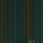 Vase with flowers against a dark green striped wall