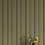 Vase of flowers against wallpaper with vertical stripes in green, blue and brown